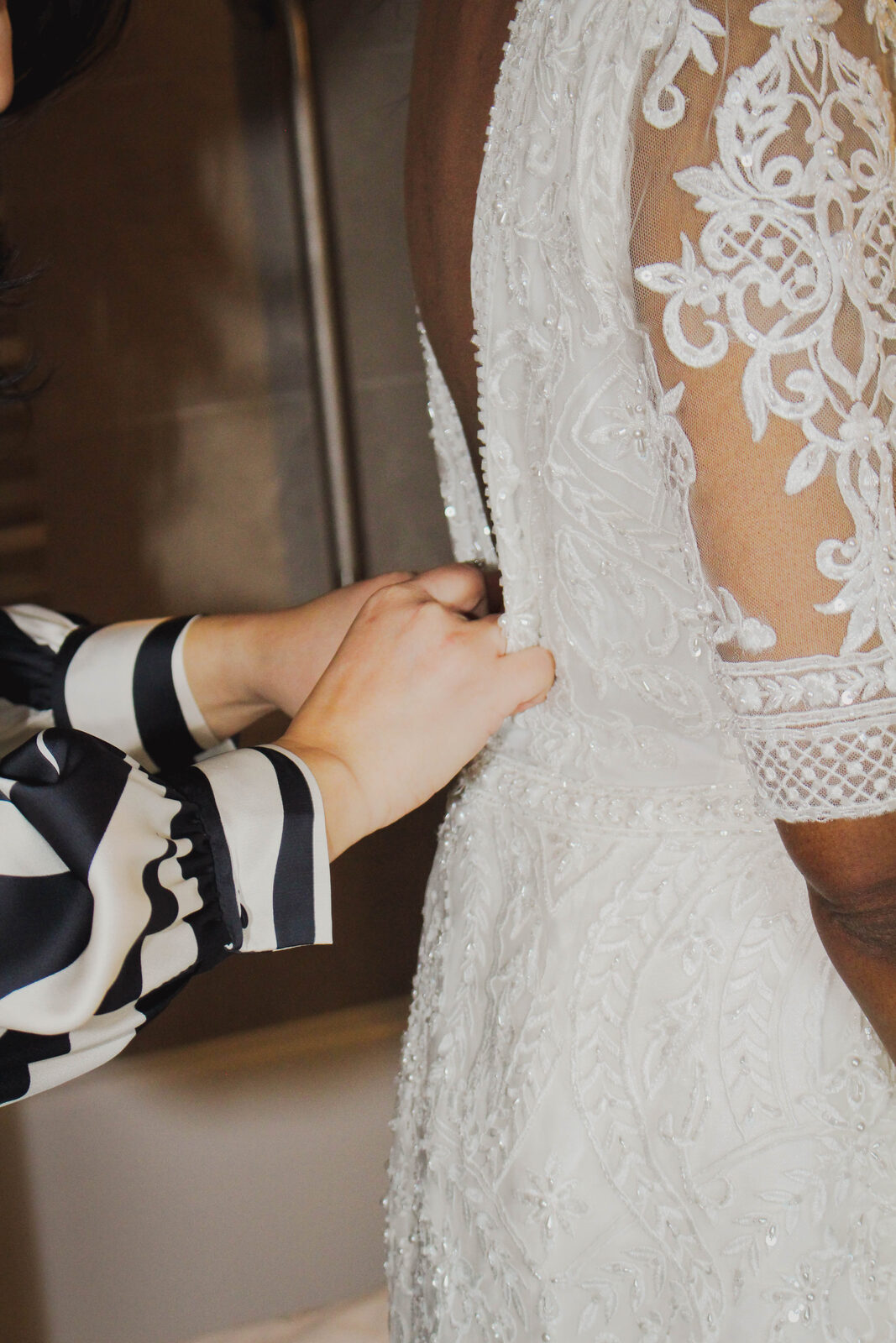 Detail of the bride's lace wedding gown